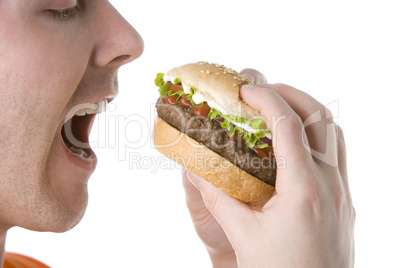 Man About To Bite Into A Cheeseburger