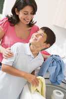 Mother And Son Doing Laundry