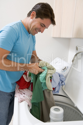 Man Loading Washing Machine