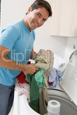 Man Loading Washing Machine