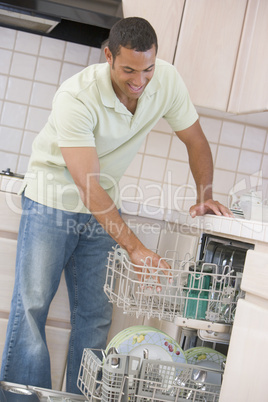 Man Loading Dishwasher