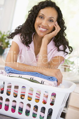 Woman Leaning On Washing In Basket