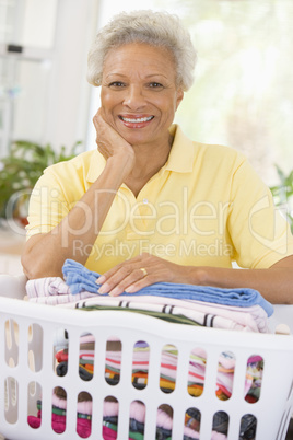 Woman Leaning On Washing Basket