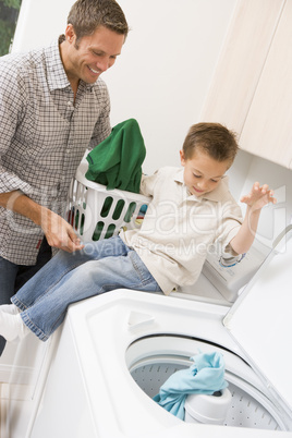 Father And Son Doing Laundry