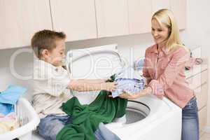 Mother And Son Doing Laundry