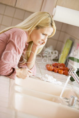 Woman At Kitchen Counter