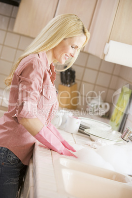 Woman Cleaning Dishes