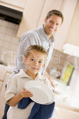 Father And Son Cleaning Dishes
