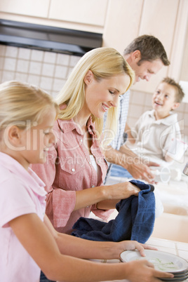 Family Cleaning Dishes Together