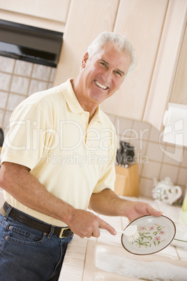 Man Cleaning Dishes