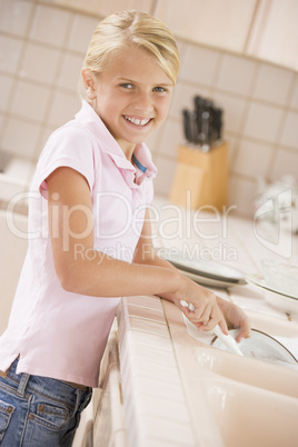 Young Girl Cleaning Dishes