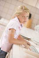 Young Girl Cleaning Dishes