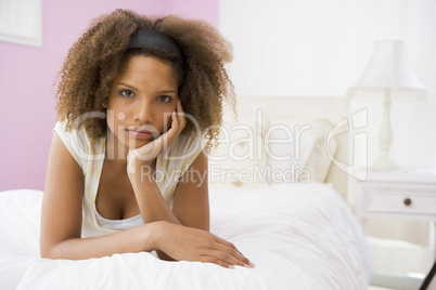 Teenage Girl Lying On Bed