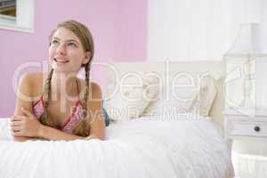 Teenage Girl Lying On Bed