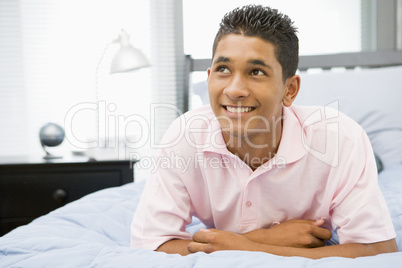 Teenage Boy Lying On Bed