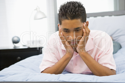 Teenage Boy Lying On Bed