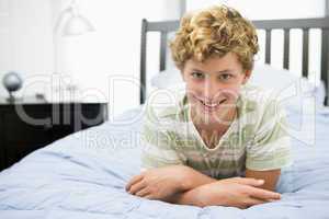 Teenage Boy Lying On Bed