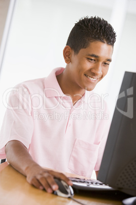 Teenage Boy Using Desktop Computer