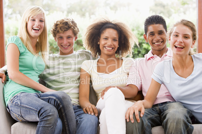 Group Of Teenagers Sitting On A Couch