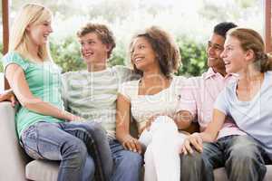 Group Of Teenagers Sitting On A Couch