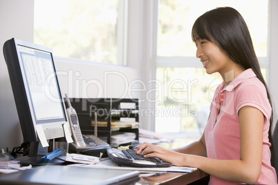 Teenage Girl Using Desktop Computer