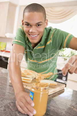 Teenage Male Making Peanut Butter Sandwich