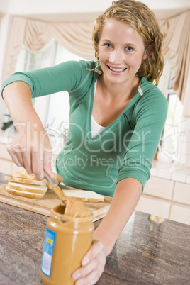Teenage Girl Making Peanut Butter Sandwich