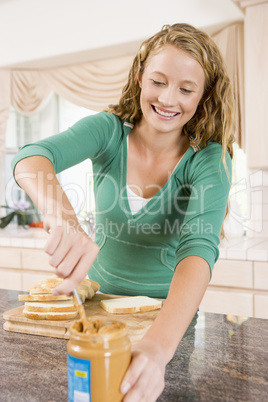 Teenage Girl Making Peanut Butter Sandwich