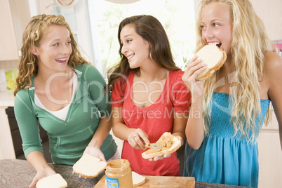 Teenage Girls Making Sandwiches