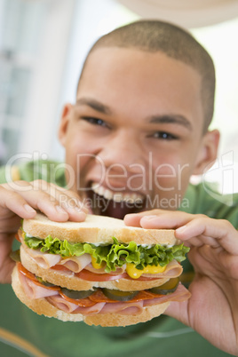 Teenage Boy Eating Sandwich