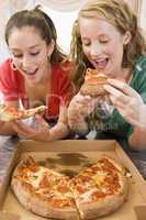 Teenage Girls Eating Pizza