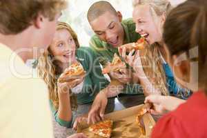 Group Of Teenagers Eating Pizza