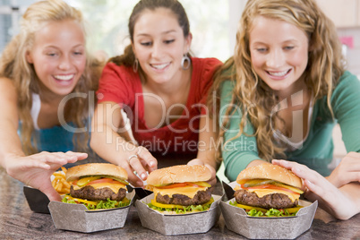 Teenage Girls Eating Burgers