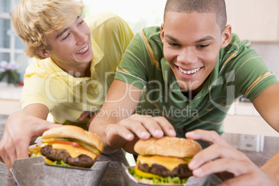 Teenage Boys Eating Burgers