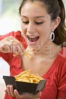 Teenage Girl Eating French Fries