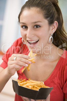 Teenage Girl Eating French Fries