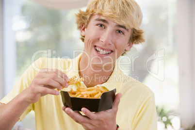 Teenage Boy Eating French Fries