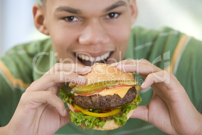 Teenage Boy Eating Burger