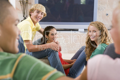 Teenagers Hanging Out In Front Of Television