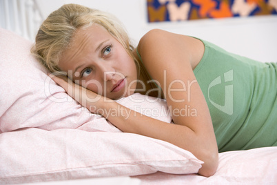 Teenage Girl Lying On Her Bed