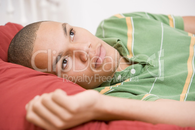 Teenage Boy Lying On Bed