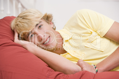 Teenage Boy Lying On Bed