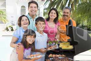 Family Enjoying A Barbeque