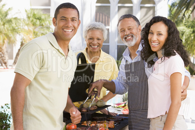 Family Enjoying A Barbeque