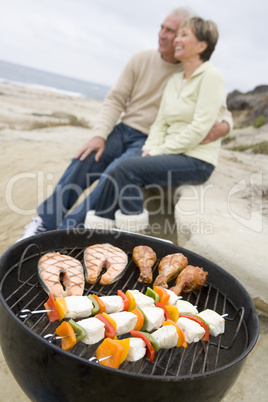 Couple Cooking On A Barbeque