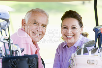 Couple Enjoying A Game Of Golf