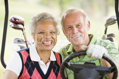 Couple Enjoying A Game Of Golf