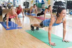 Instructor Taking Exercise Class At Gym