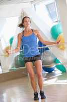 Woman Using Skipping Rope At Gym