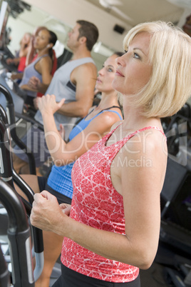 Woman Running On Treadmill At Gym